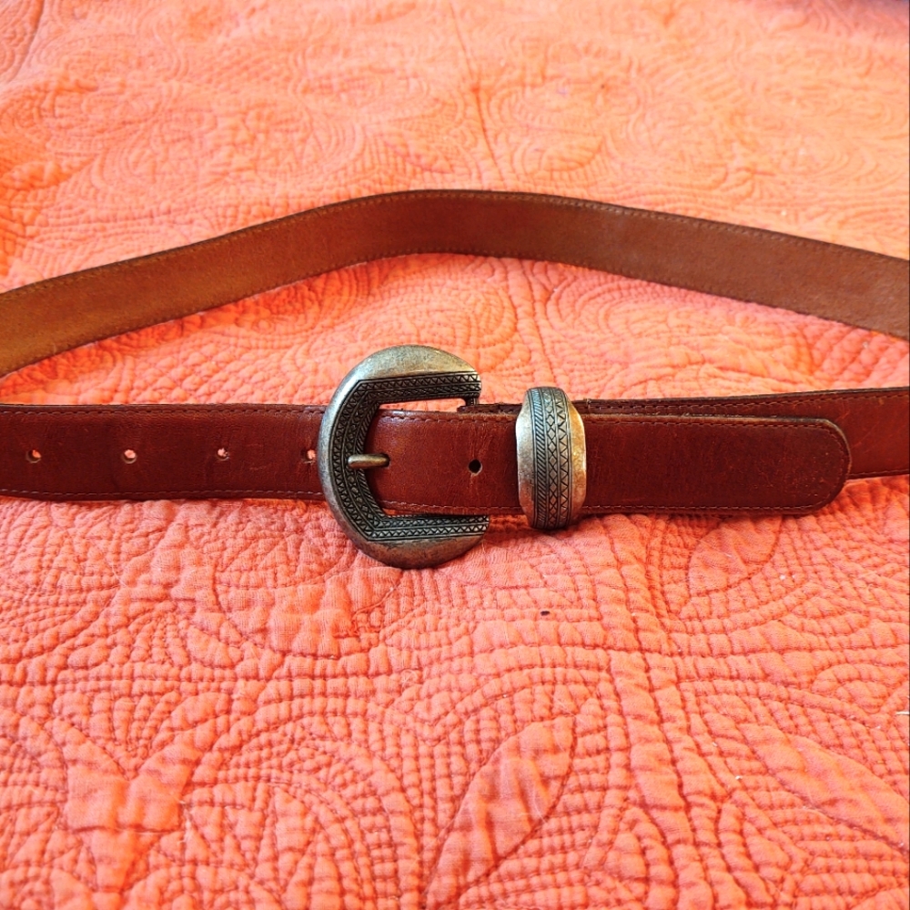 Leather belt, brown 38x1 in. No noted brand on it.